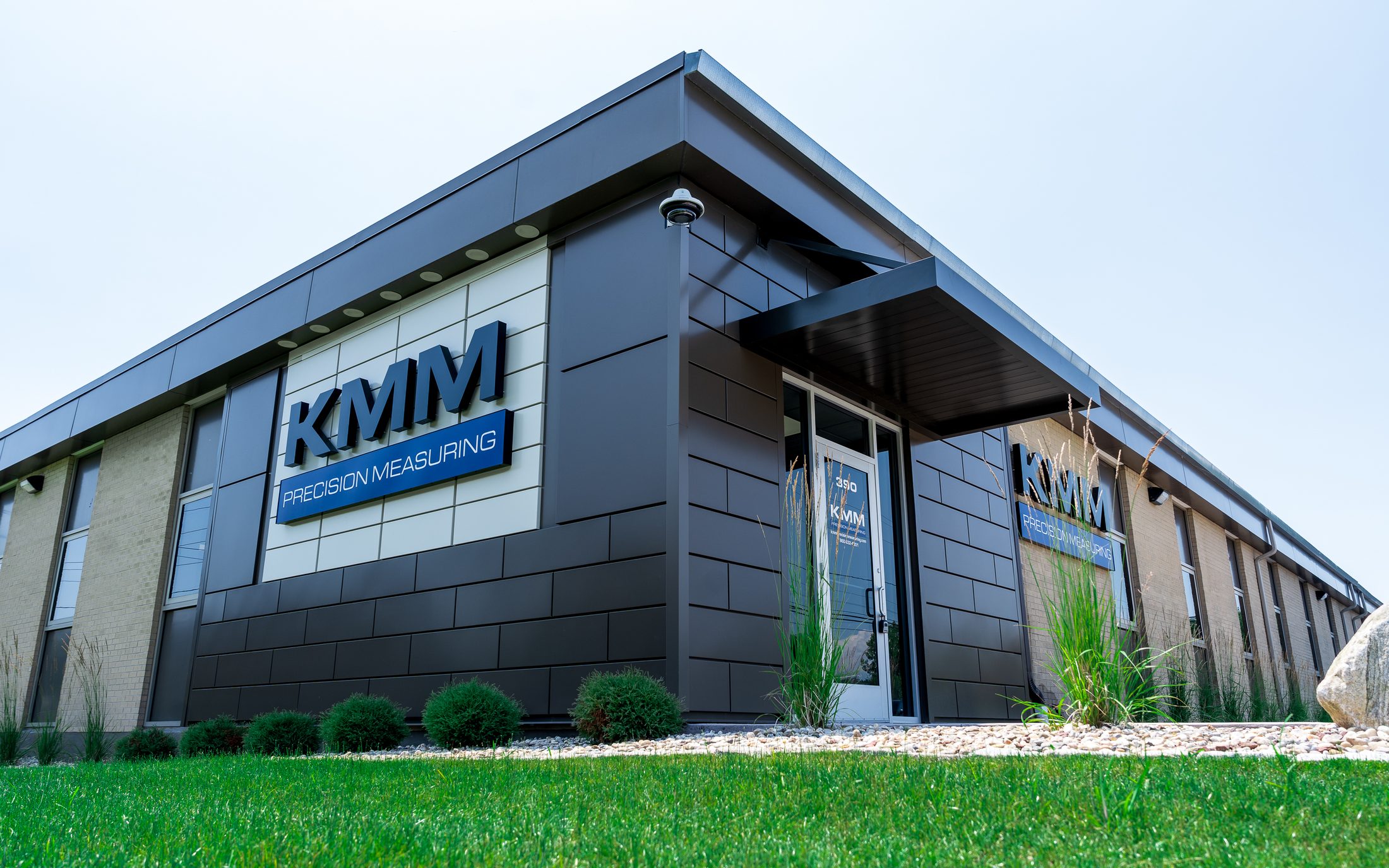 Modern flat-panel entrance canopy at KMM Precision Measuring by Manchester Awning